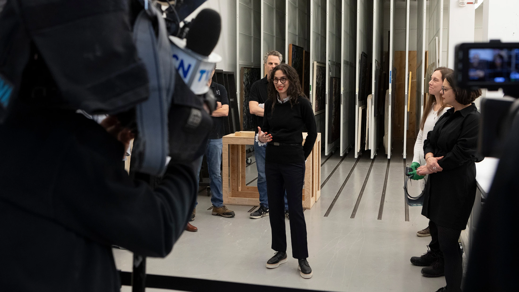 Journalists attending an unpacking of artworks with the curator // Photo: MNBAQ, David Cannon